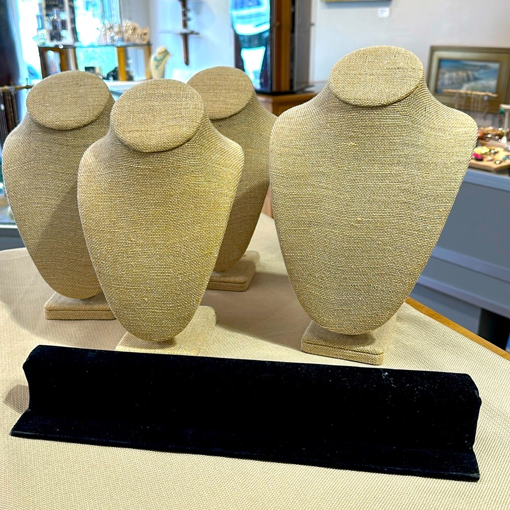 Five linen necklace displays